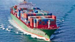 A container ship is traveling across the ocean