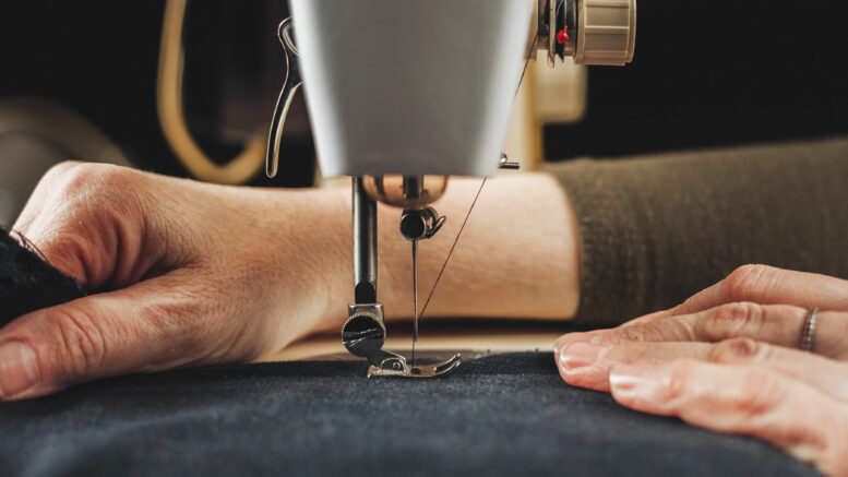 Sewing machine training person